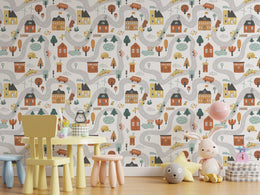 Playful urban village wallpaper design with roads, school structures, transit buses, and colorful houses for preschool classroom