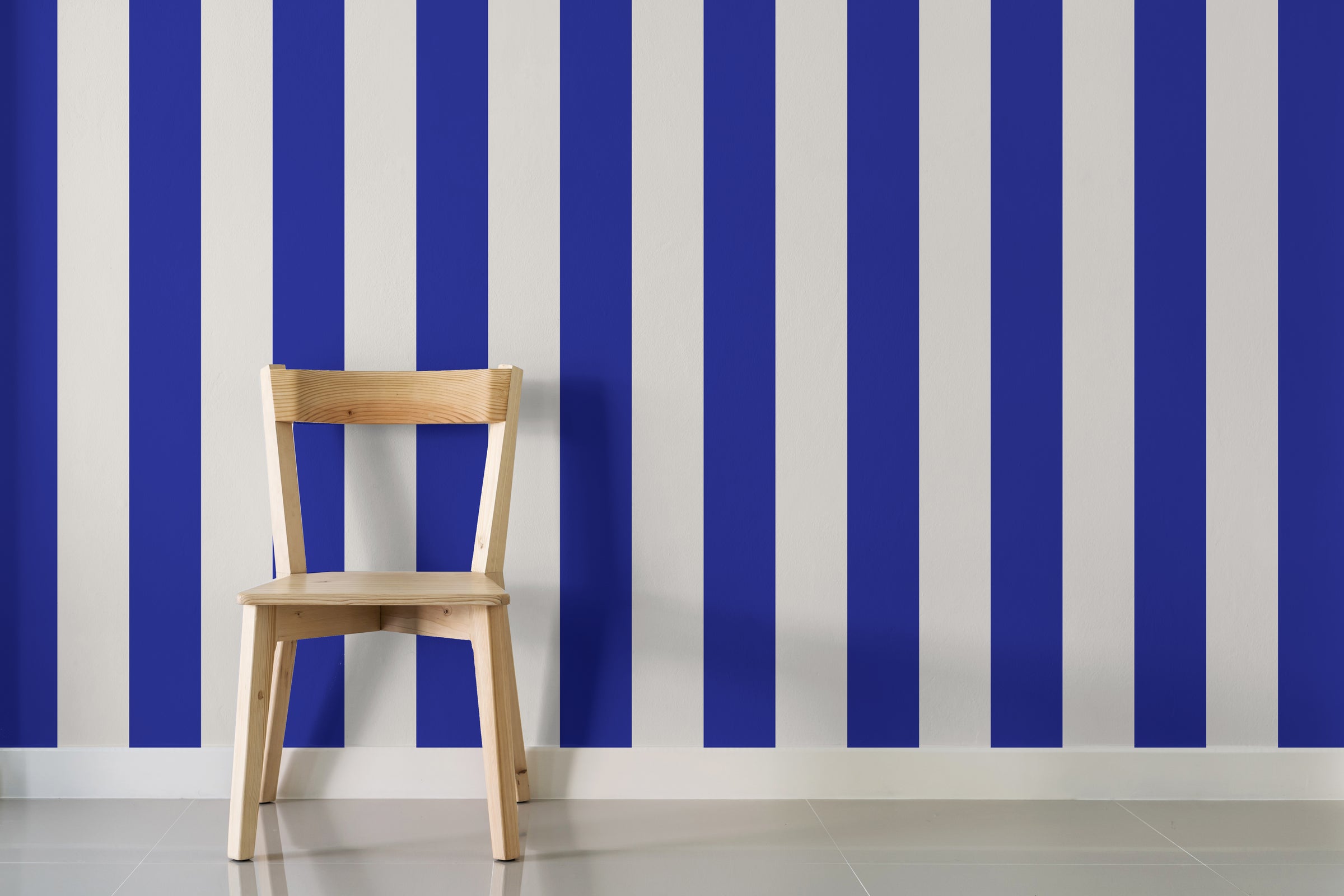 Bold blue stripe pattern enhancing dining room wall with clean lines