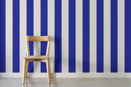 Bold blue stripe pattern enhancing dining room wall with clean lines