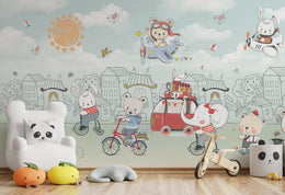 Kids wall mural with traveling teddy, colorful transport scenes, flying birds, and sunny sky decor for kids study rooms.