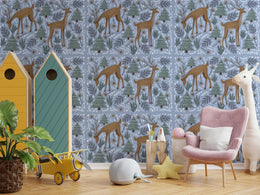 Forest animal wall art in muted blue tones enhances cozy nursery space