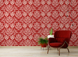 Elegant red damask pattern wall covering enhancing sophisticated living room interior ambiance