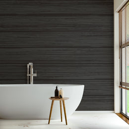 Matte black wooden panel effect bringing refined warmth to a minimalist restroom space.