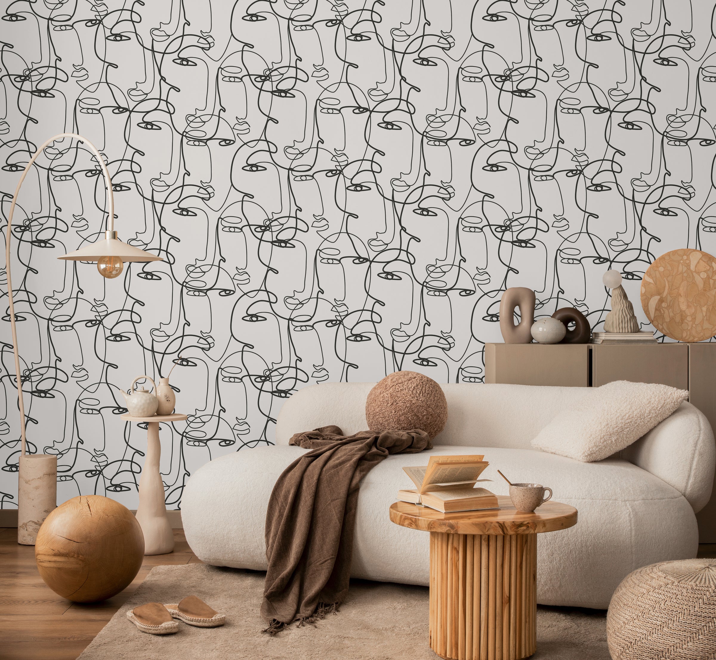 Elegant home interior decorated with abstract continuous portrait line artwork wall design forming statement feature background inside contemporary living room