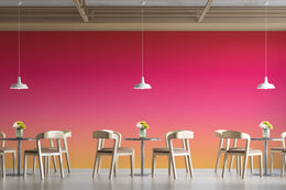 High-end dining area decor with gradient wall decor, pink orange hues, built for statement spaces