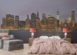 Luxury bedroom decorated with glowing metropolitan skyline wallpaper showing tall buildings and evening city lights reflection.