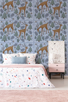 Soft blue deer and forest wall design adds charm to kids bedroom decor
