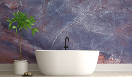 Minimalist bathroom accent wall featuring soft blue purple marble pattern wallpaper