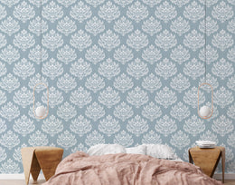 Elegant pale blue patterned wall surface welcoming visitors with charming traditional decorative atmosphere.