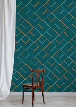 Luxury lounge area featuring teal geometric wallpaper with refined gold detailing